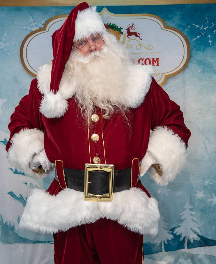 Xmas red velvet suit with a flared front is piped with a gold panel down the front to highlight the buttons is done in polar bear fur.